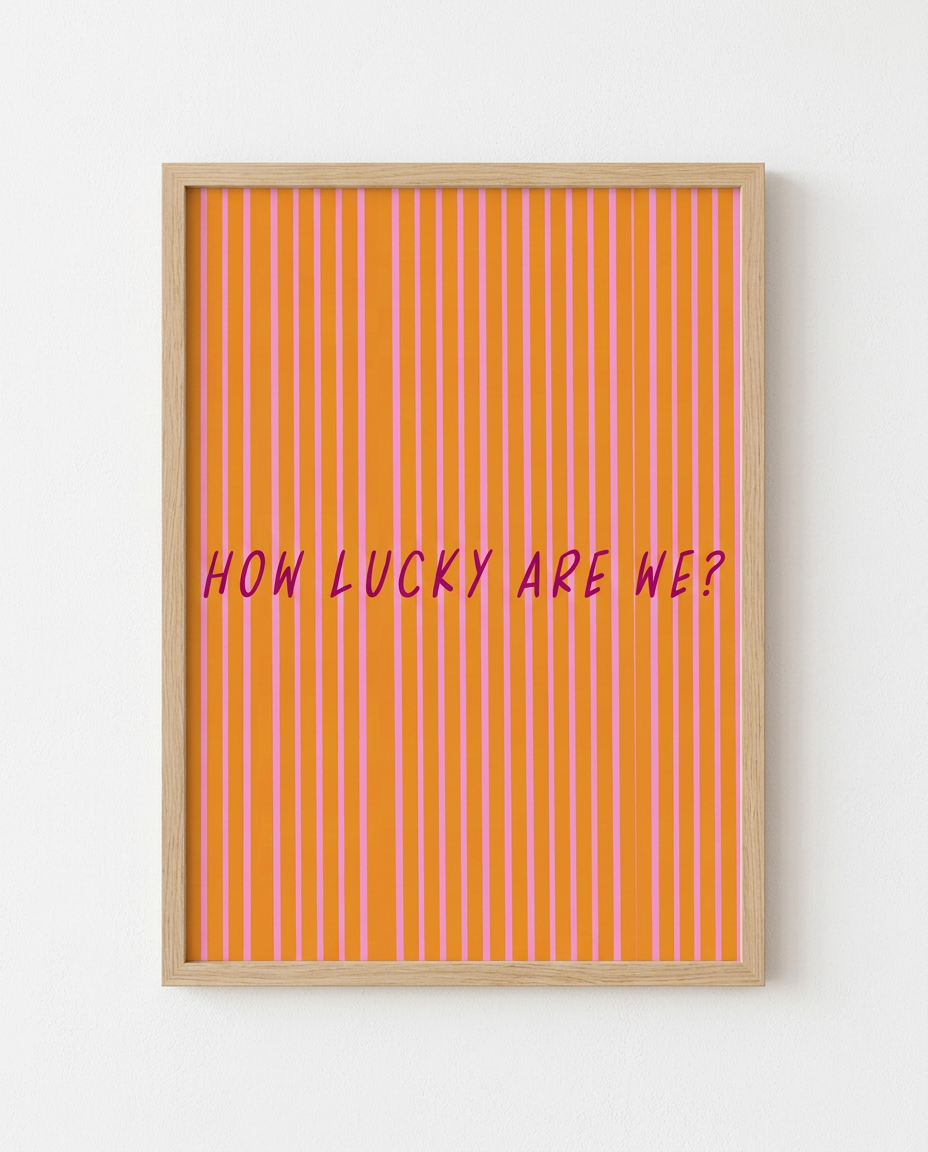 How Lucky Are We? illustration by Mol printed A4 in a natural wooden frame on a white wall