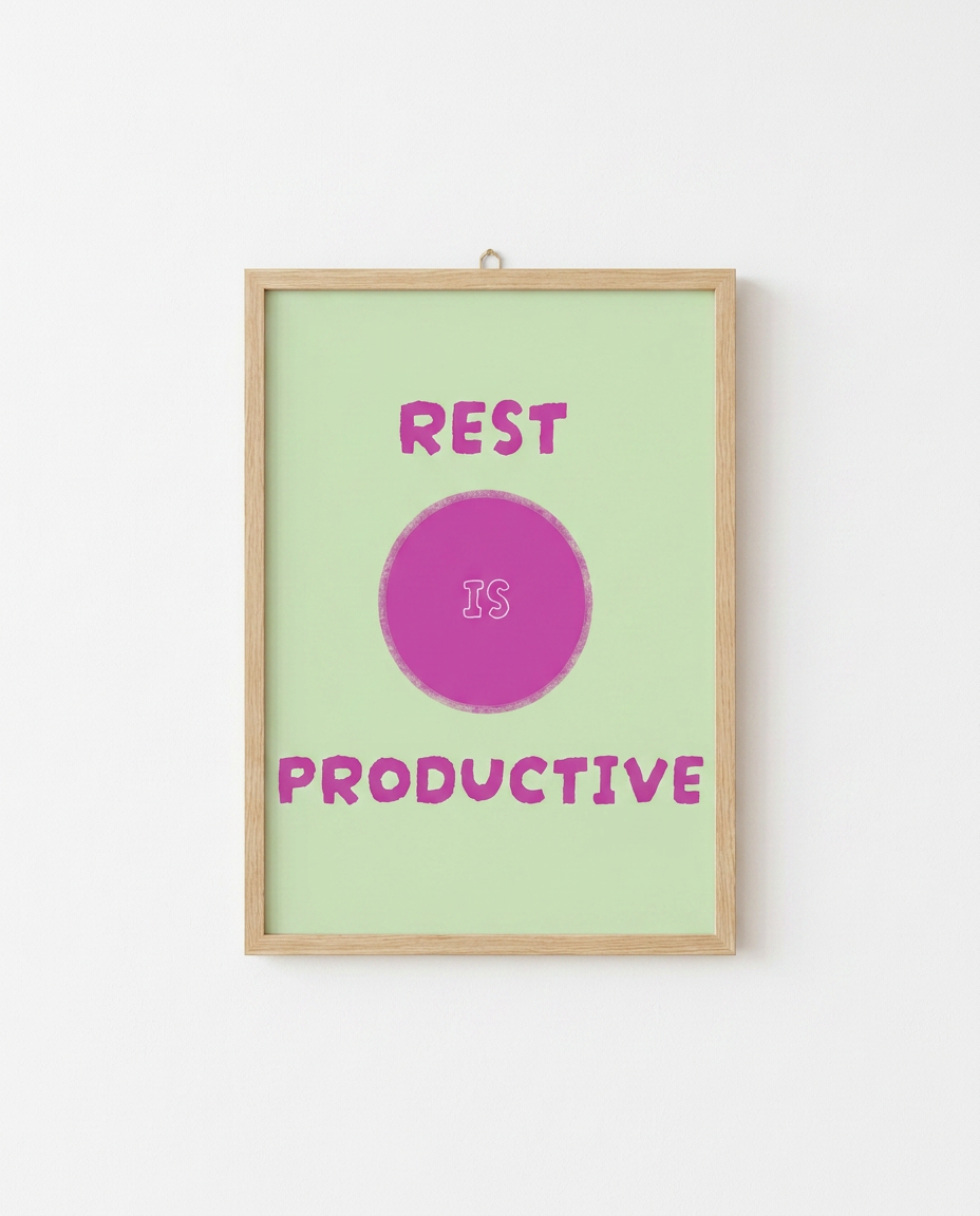 Rest Is Productive illustration by Mol printed A4 in a natural wooden frame on a white wall